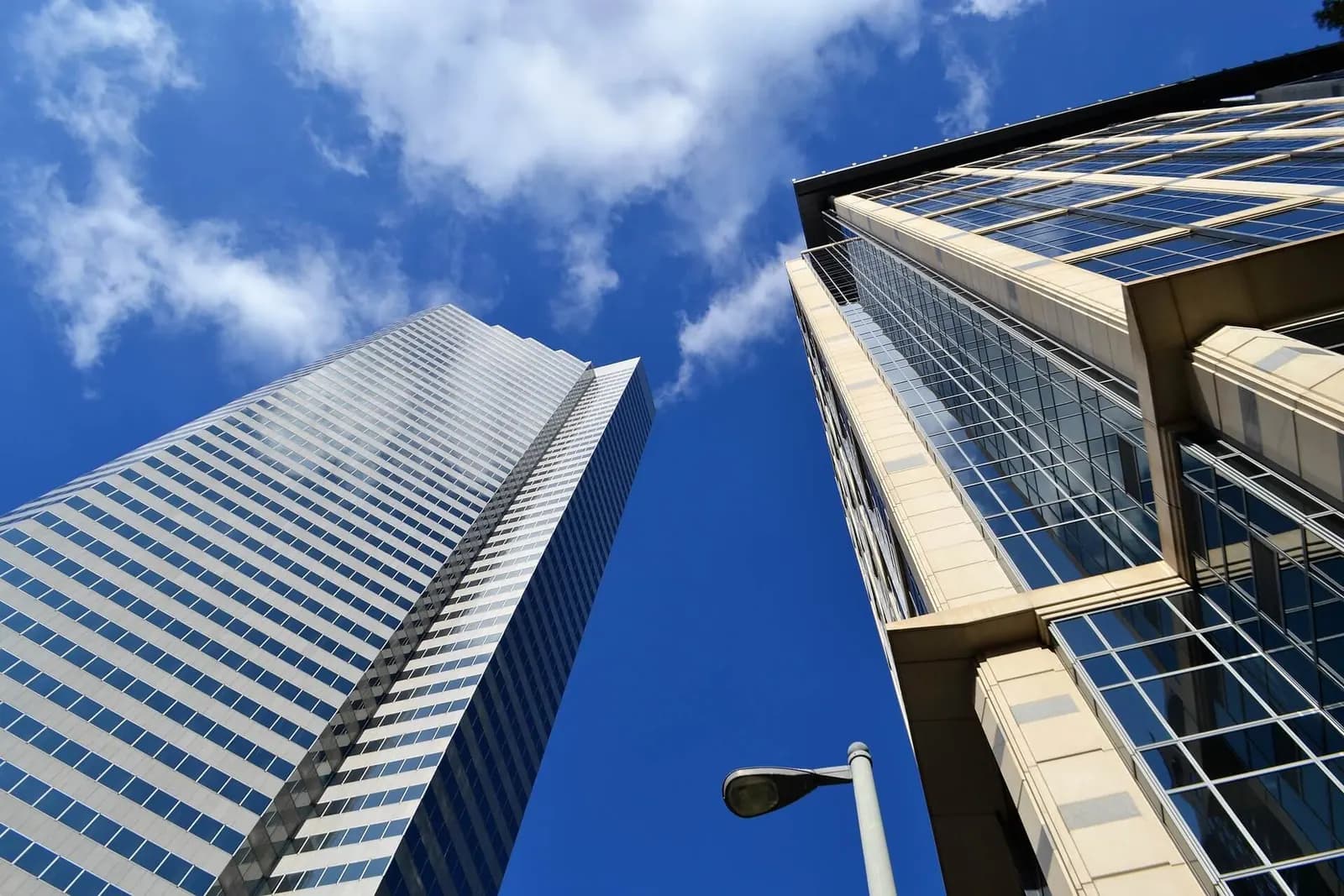 Two city office towers seen from below