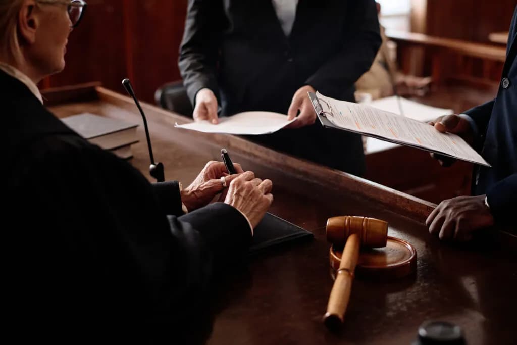 A courtroom bench with a gavel during a hearing